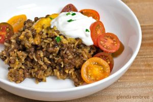 lentil and rice casserole in white bowl